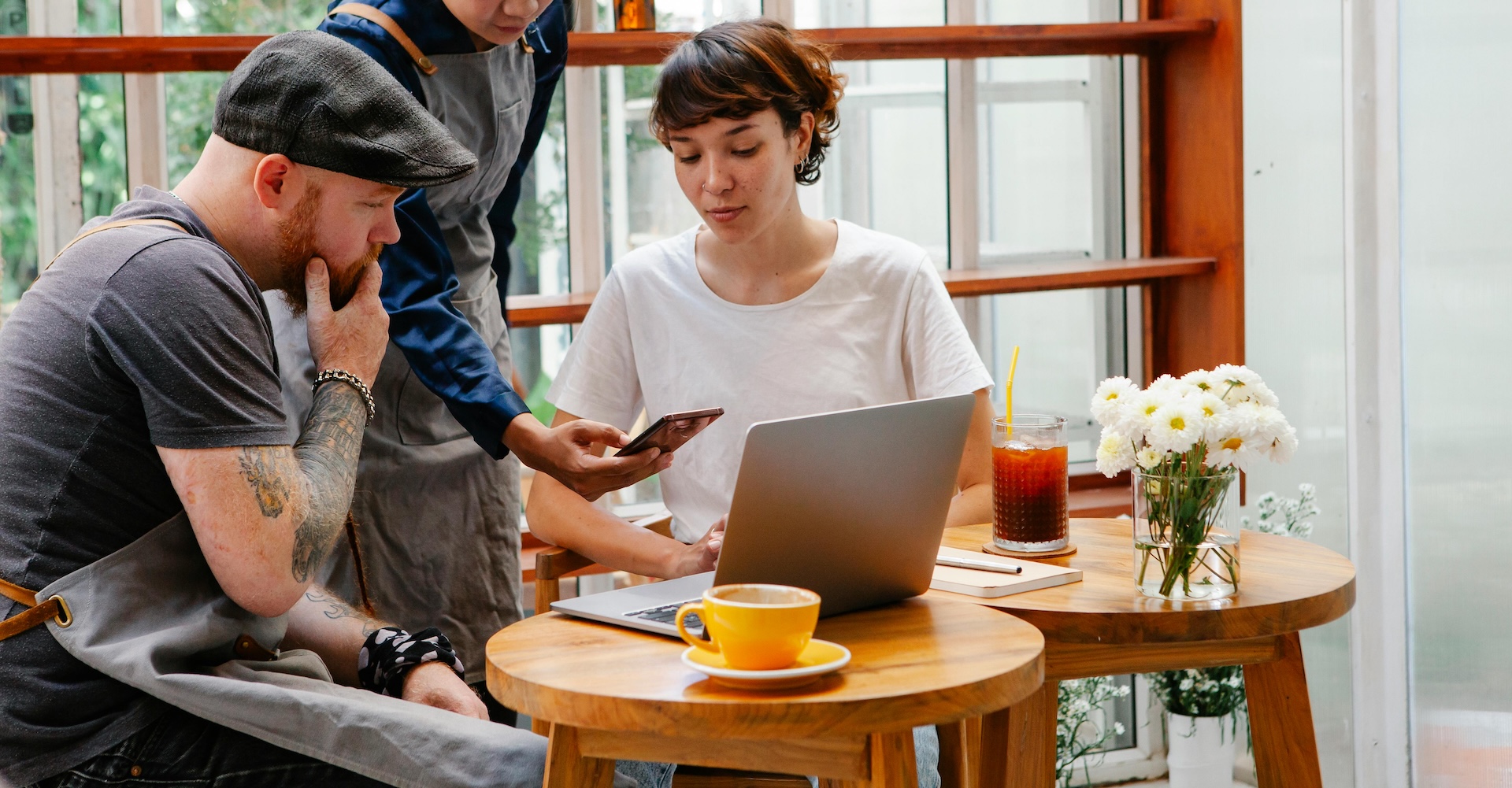 restaurant staff working on laptop and tablet